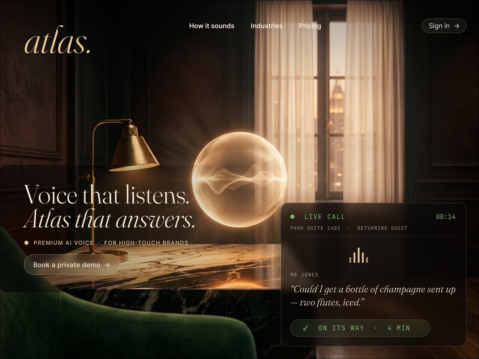 Atlas voice AI concierge: candlelit suite with the orb on a marble side table, atlas wordmark in italic gold, live call card showing a guest champagne request.